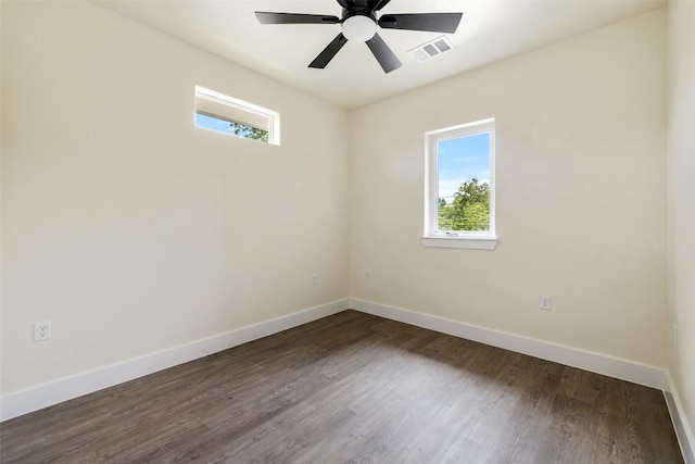 1000 Vargas Rd Unit A, Austin, TX 78741 - empty room with plenty of natural light, dark wood finished floors, and ceiling fan