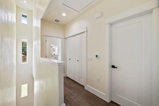 hall featuring recessed lighting, baseboards, visible vents, and dark wood-style floors