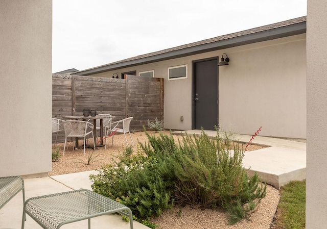exterior space featuring fence and outdoor dining space