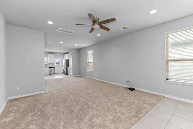316 Ancellotta Way, Leander, TX 78641 - unfurnished living room with a ceiling fan, recessed lighting, baseboards, light colored carpet, and light tile patterned floors