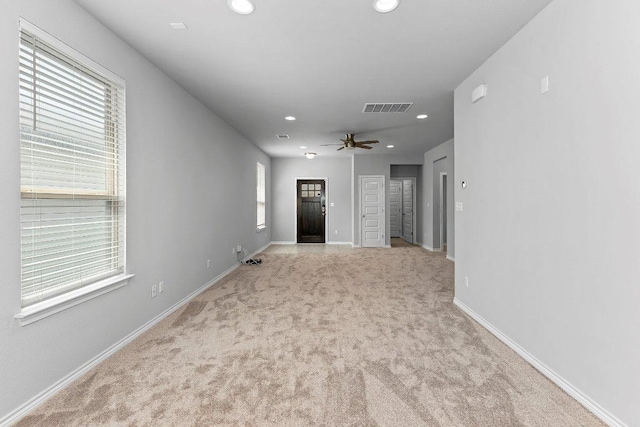 316 Ancellotta Way, Leander, TX 78641 - unfurnished living room featuring light colored carpet, recessed lighting, a ceiling fan, and baseboards