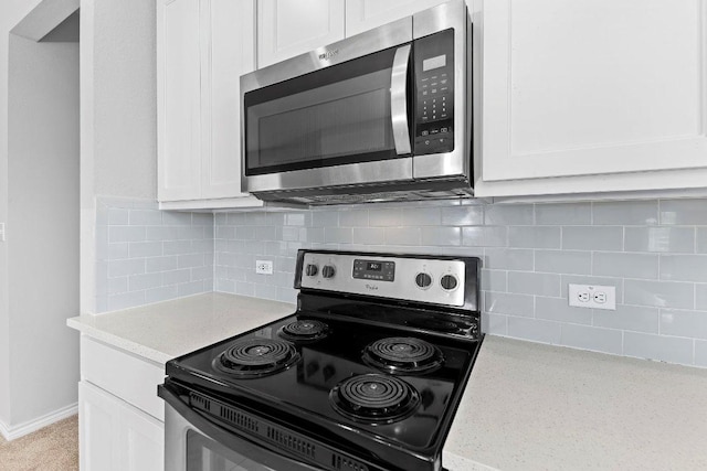 316 Ancellotta Way, Leander, TX 78641 - kitchen featuring appliances with stainless steel finishes, white cabinets, and decorative backsplash