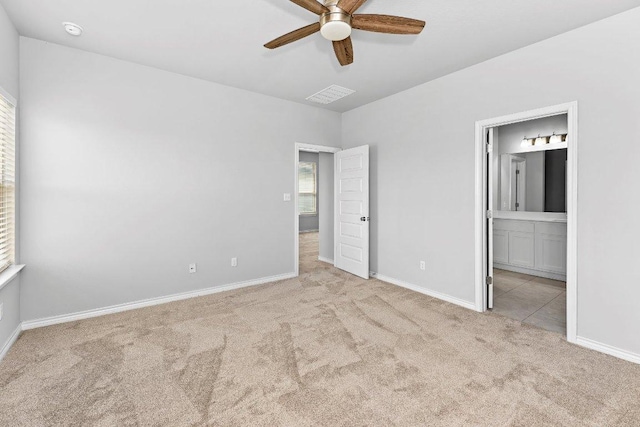 316 Ancellotta Way, Leander, TX 78641 - unfurnished bedroom featuring carpet floors, baseboards, and connected bathroom