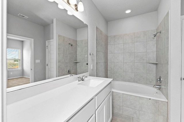 316 Ancellotta Way, Leander, TX 78641 - bathroom featuring tiled shower / bath and vanity