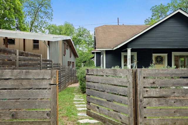1613 Garden St, Austin, TX 78702 - view of home's exterior with a shingled roof