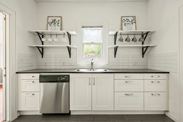 1613 Garden St, Austin, TX 78702 - kitchen featuring dishwasher, open shelves, dark countertops, and tasteful backsplash