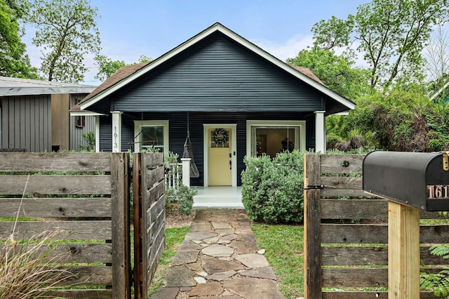 1613 Garden St, Austin, TX 78702 - bungalow featuring covered porch and a gate