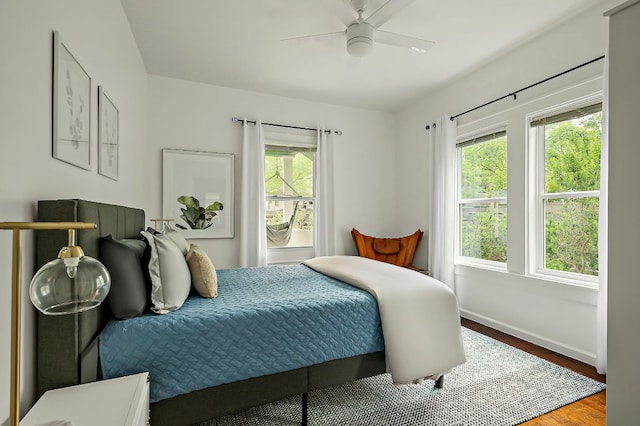 1613 Garden St, Austin, TX 78702 - bedroom featuring a ceiling fan, baseboards, and wood finished floors