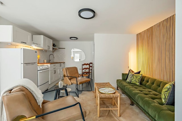 living area featuring light colored carpet