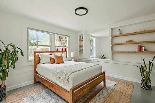 bedroom featuring multiple windows