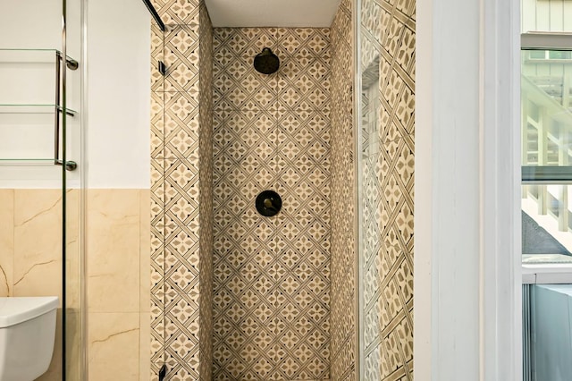 details featuring toilet and a shower stall