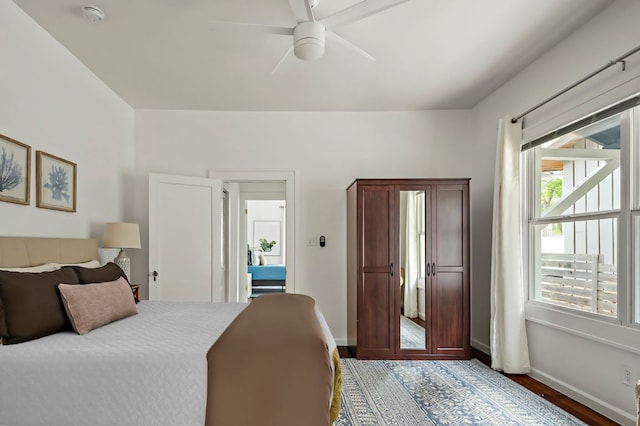 1613 Garden St, Austin, TX 78702 - bedroom with a ceiling fan, baseboards, and light wood-style flooring