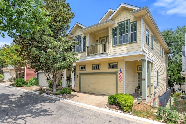 6704 Menchaca Rd Unit 43, Austin, TX 78745 - townhome / multi-family property featuring a balcony, an attached garage, and driveway