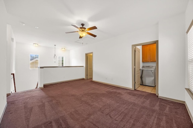 6704 Menchaca Rd Unit 43, Austin, TX 78745 - unfurnished living room with washer / clothes dryer, attic access, light colored carpet, a ceiling fan, and baseboards