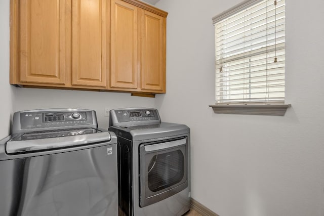 6704 Menchaca Rd Unit 43, Austin, TX 78745 - washroom featuring washer and clothes dryer and cabinet space