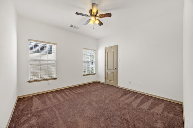 6704 Menchaca Rd Unit 43, Austin, TX 78745 - carpeted spare room featuring baseboards and a ceiling fan