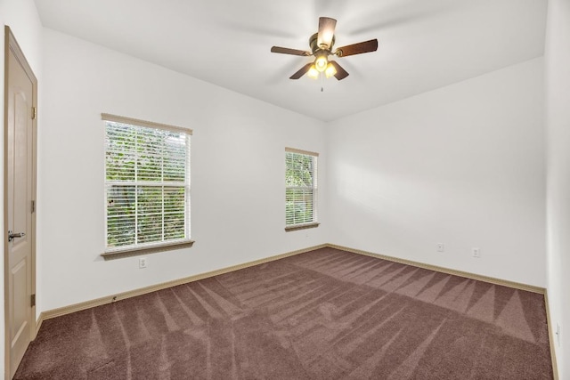 6704 Menchaca Rd Unit 43, Austin, TX 78745 - unfurnished room with carpet floors, baseboards, and a ceiling fan