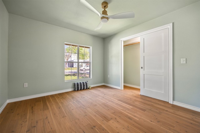 1007 Payne Ave, Austin, TX 78757 - unfurnished bedroom featuring baseboards, a ceiling fan, and light wood-type flooring