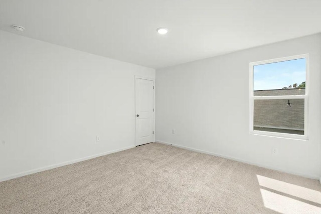 1441 Morris Loop, San Marcos, TX 78666 - carpeted empty room with baseboards and recessed lighting