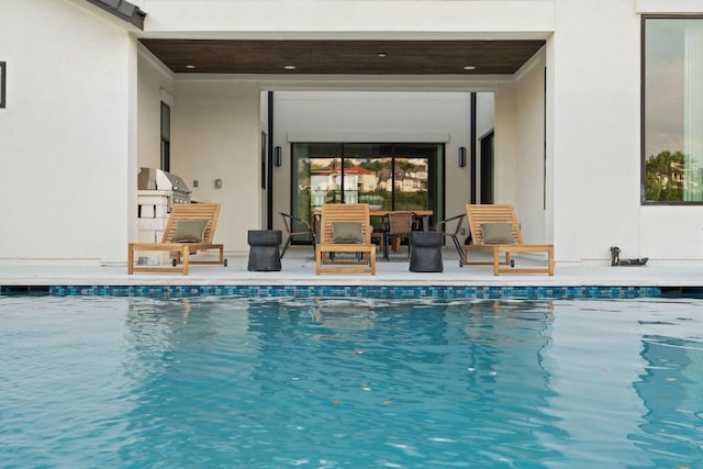 outdoor pool with grilling area