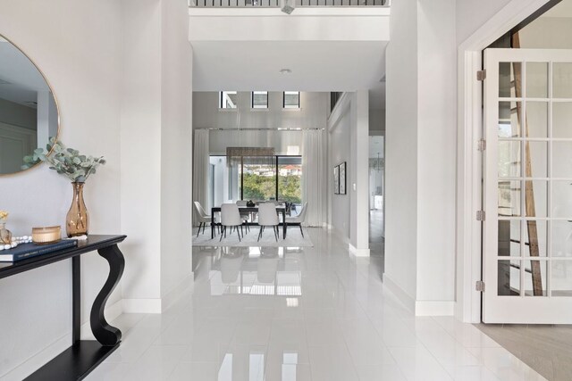 tiled foyer with baseboards