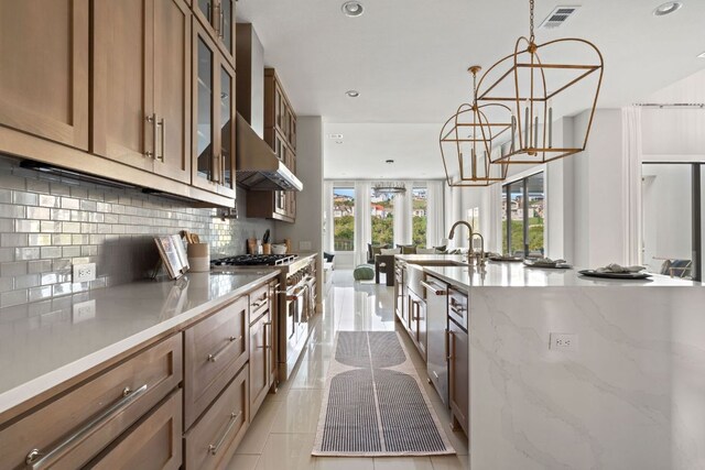 kitchen featuring recessed lighting, appliances with stainless steel finishes, decorative backsplash, and visible vents