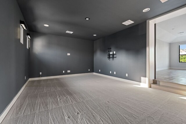 spare room with carpet floors, recessed lighting, and baseboards