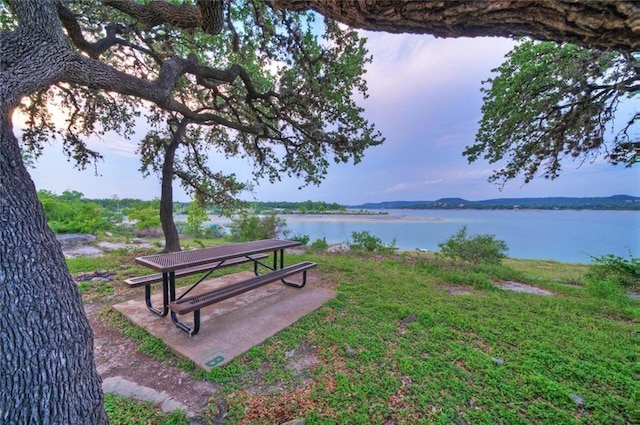 surrounding community with a water view