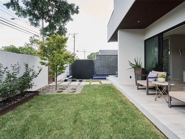 view of yard with a fenced backyard