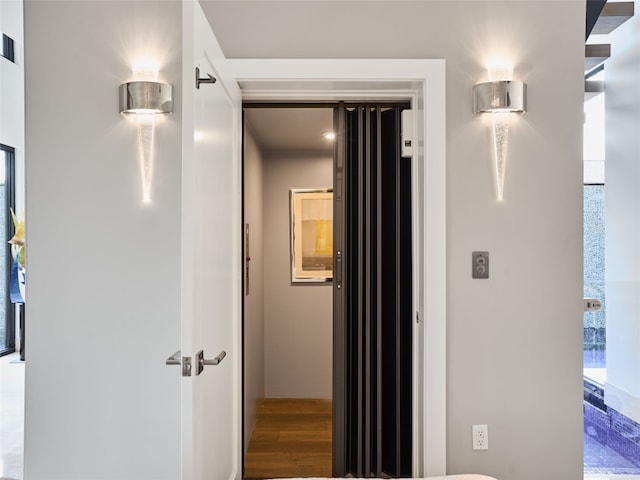 hall featuring wood finished floors