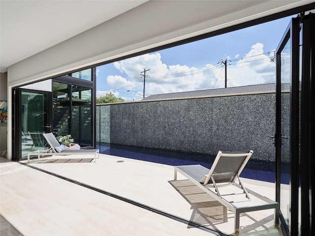 view of patio / terrace with a balcony