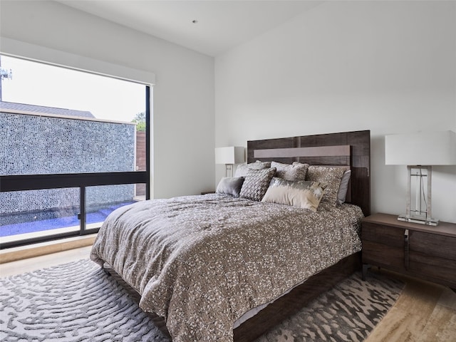 bedroom featuring wood finished floors