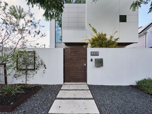 entrance to property featuring fence and a gate