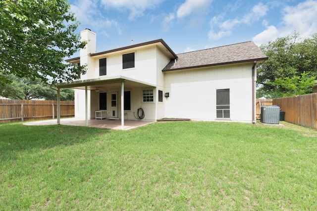 1809 Woodland Dr, Cedar Park, TX 78613 - rear view of house featuring central air condition unit, a patio, a chimney, and a yard
