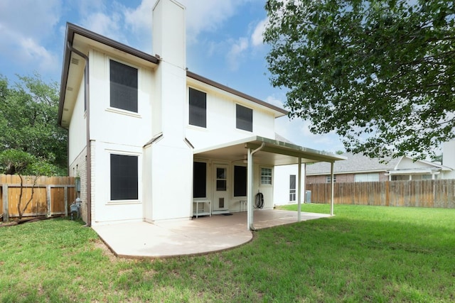 1809 Woodland Dr, Cedar Park, TX 78613 - rear view of house with a fenced backyard, a patio, a chimney, and a yard