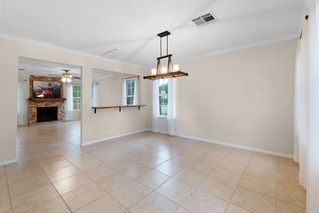 1809 Woodland Dr, Cedar Park, TX 78613 - unfurnished dining area featuring crown molding, visible vents, plenty of natural light, and light tile patterned floors