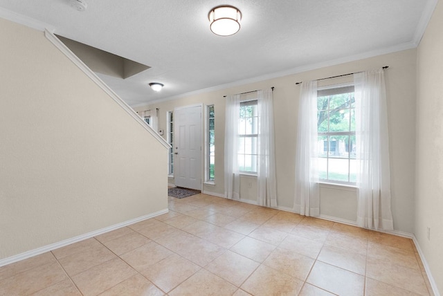 1809 Woodland Dr, Cedar Park, TX 78613 - entryway with baseboards, ornamental molding, and light tile patterned floors