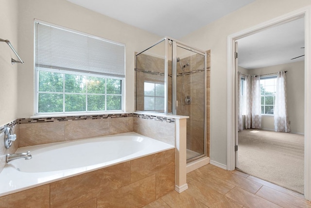 1809 Woodland Dr, Cedar Park, TX 78613 - bathroom featuring a garden tub, tile patterned flooring, and a stall shower