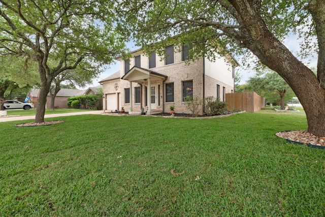 1809 Woodland Dr, Cedar Park, TX 78613 - view of front of property featuring a garage, fence, a front yard, brick siding, and driveway
