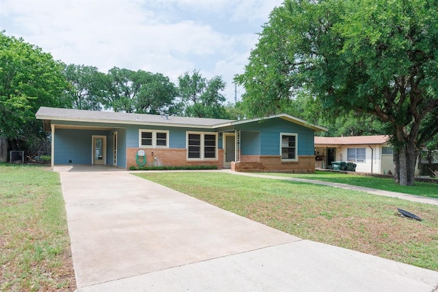 ranch-style home with a carport, concrete driveway, a front lawn, and brick siding