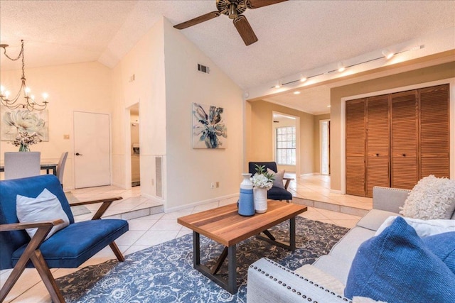 living room featuring baseboards, a textured ceiling, light tile patterned floors, and ceiling fan with notable chandelier