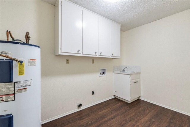 laundry room with cabinet space, a sink, water heater, dark wood-type flooring, and hookup for an electric dryer