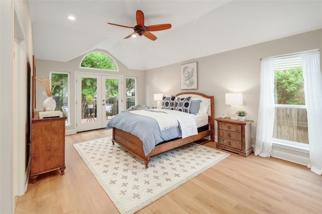 bedroom with access to outside, ceiling fan, light wood finished floors, french doors, and lofted ceiling