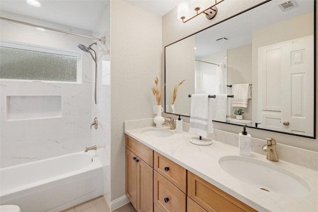 full bathroom featuring double vanity, visible vents, a sink, and shower / bathing tub combination