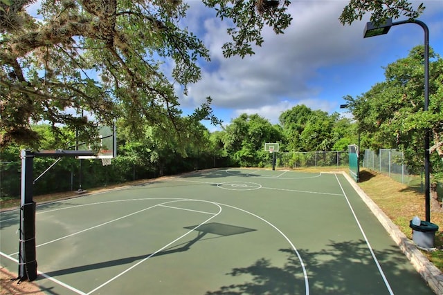 view of sport court featuring fence and community basketball court