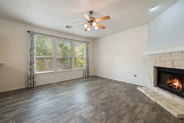 407 N Lori Cir, Bastrop, TX 78602 - unfurnished living room featuring a ceiling fan, dark wood finished floors, a fireplace, and baseboards
