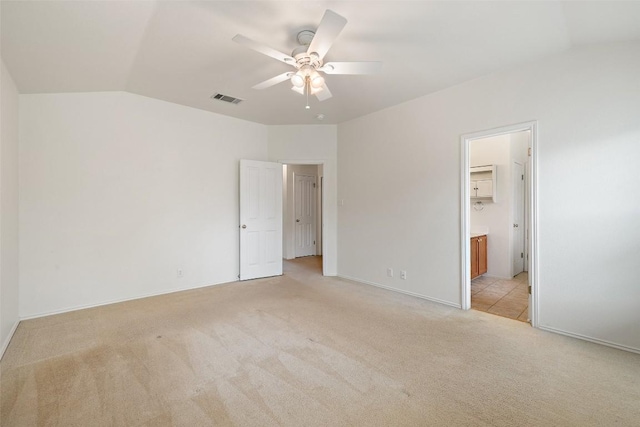 407 N Lori Cir, Bastrop, TX 78602 - unfurnished bedroom featuring light colored carpet, lofted ceiling, ensuite bath, a ceiling fan, and baseboards