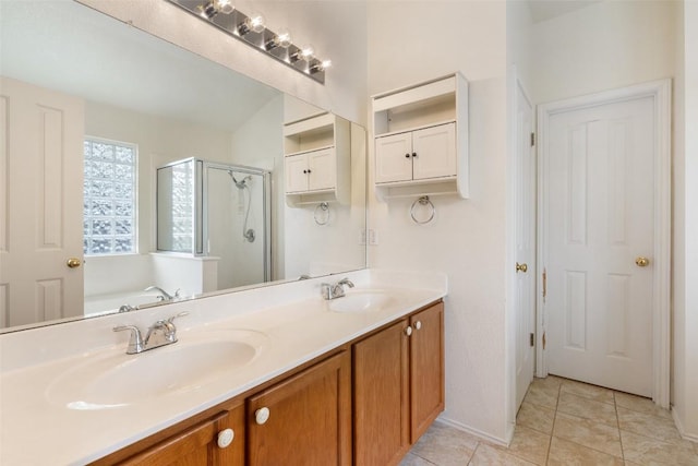 407 N Lori Cir, Bastrop, TX 78602 - full bath featuring a shower stall, double vanity, a garden tub, and tile patterned floors