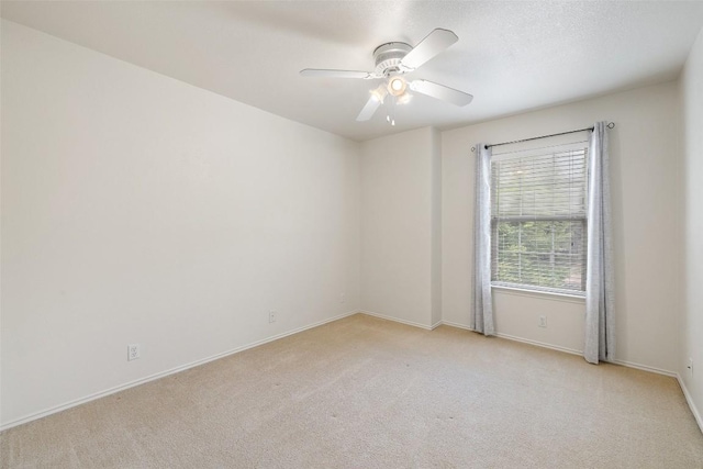 407 N Lori Cir, Bastrop, TX 78602 - unfurnished room with light colored carpet, a ceiling fan, and baseboards