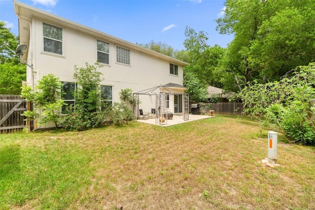 407 N Lori Cir, Bastrop, TX 78602 - back of property with a patio area and stucco siding